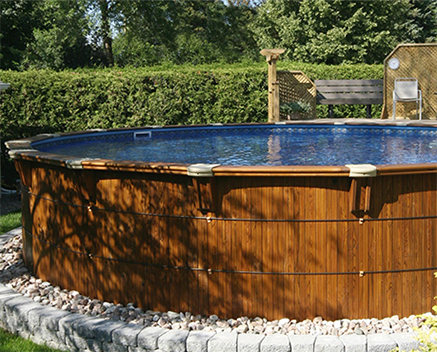 Semi-inground pool in Toronto with custom wooden shell.