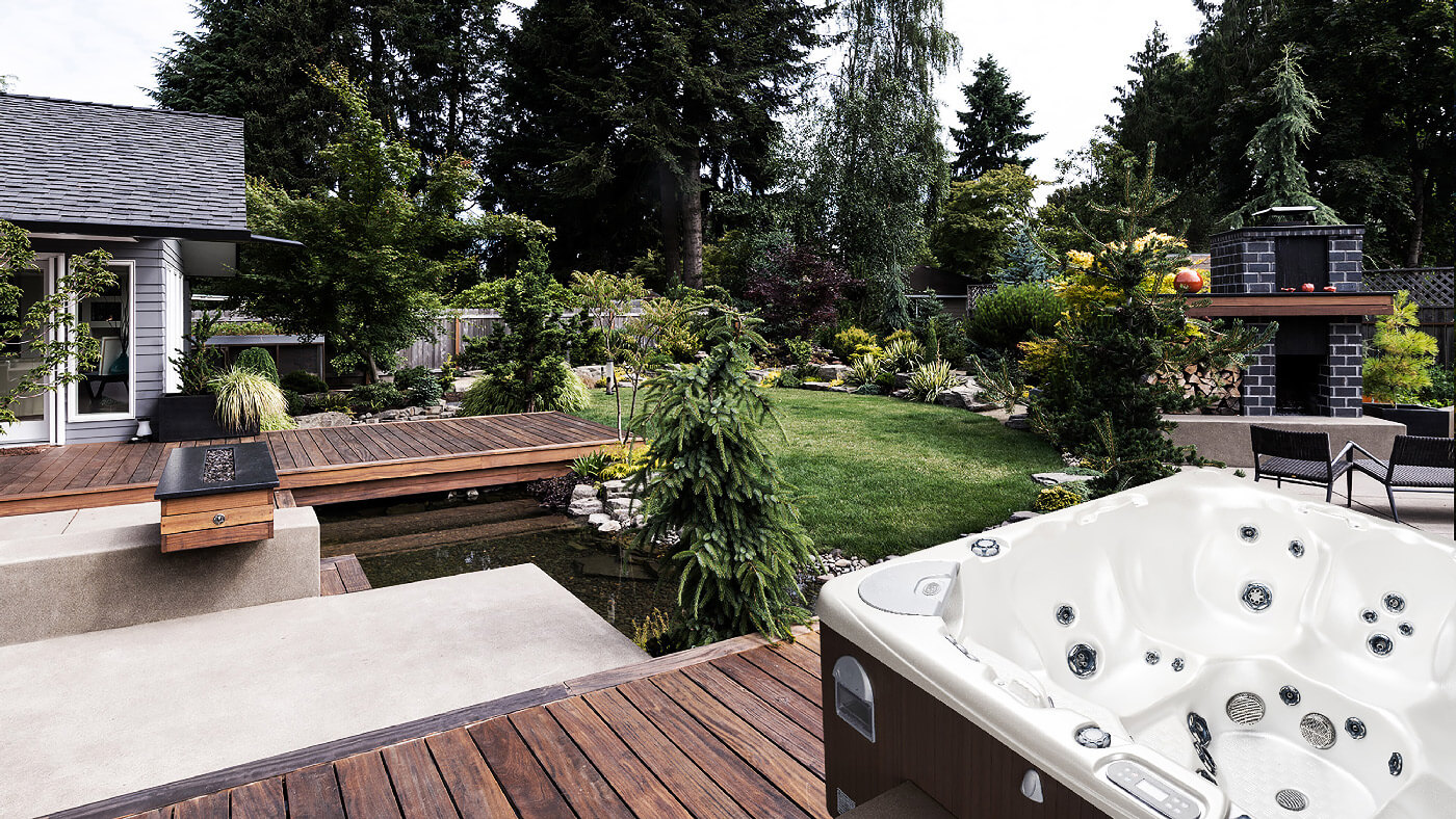 Full landscape design in Toronto backyard with Beachcomber hot tub from Seaway Pools & Hot Tubs