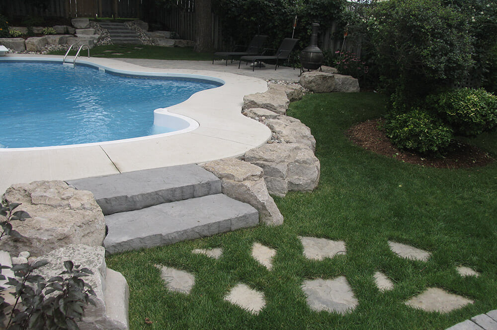 Stone pool steps installed by Seaway Pools & Hot Tubs
