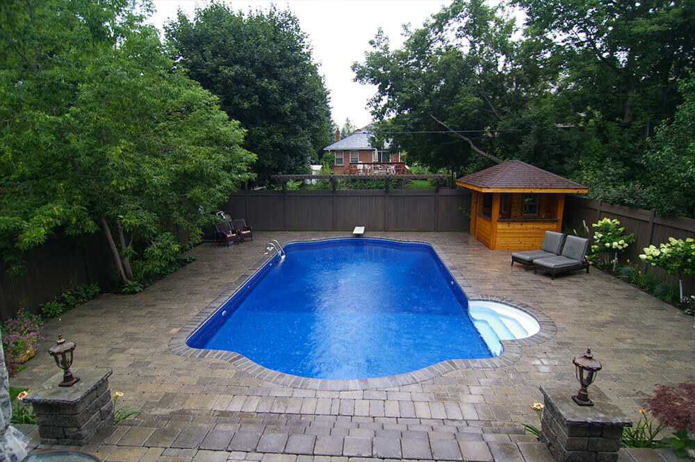Rectangle inground pool & patio stone installation by Seaway Pools & Hot Tubs