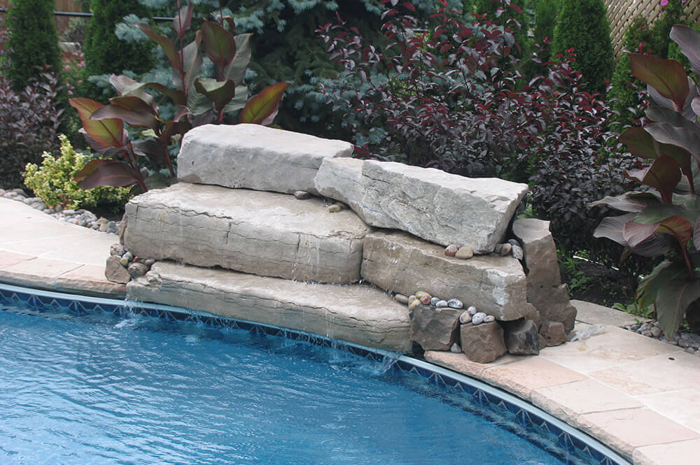 Poolside stonework by Seaway Pools & Hot Tubs