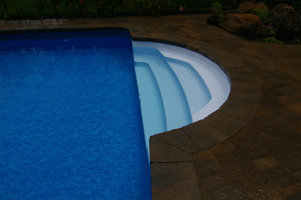 In-pool seating area designed by Seaway Pools & Hot Tubs