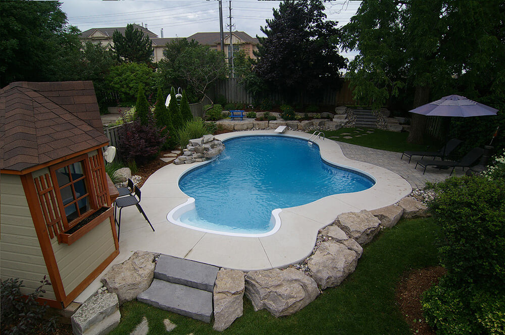 Vinyl lined inground pool, with custom designed shape by Seaway Pools
