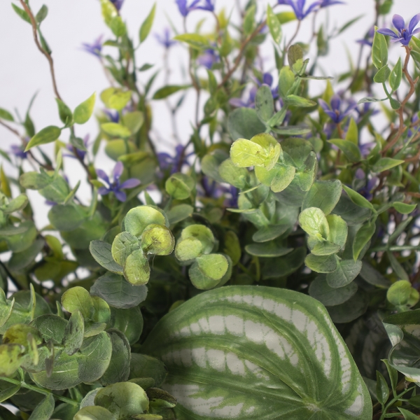 peperomias, small purple flowers and mixed greens faux floral planter