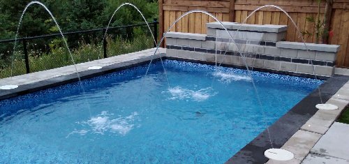 Seaway inground swimming pool installed with multiple deckjets