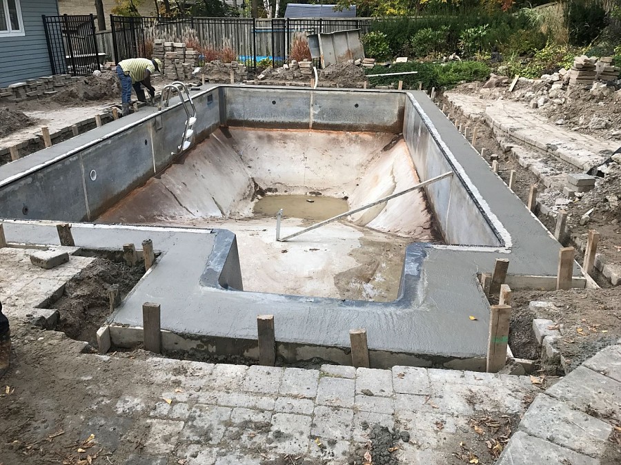 Galvanized steel wall installation for inground swimming pool