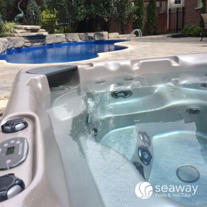 backyard swimming pool and hot tub