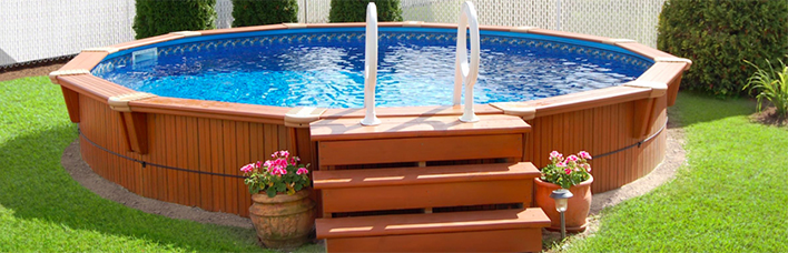 Semi-inground pool with custom wooden shell.